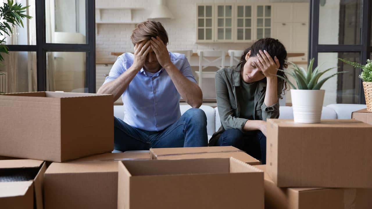 23% of homebuyers tell pollsters they regret paying too much 1 couple stress moving 1 hOip1V