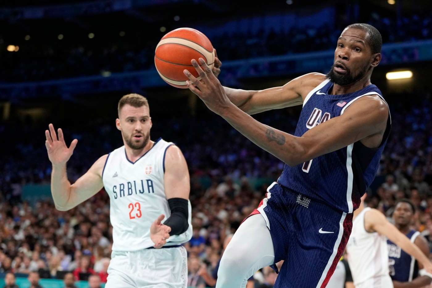 Olympic basketball: Team USA men open with blowout of Serbia 1 AP24210605625221 rveFV2