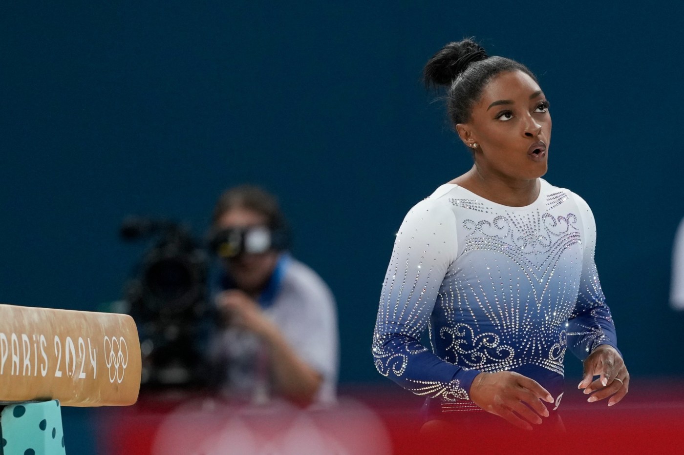 Simone Biles falls in Olympic balance beam bid 1 AP24218416264002