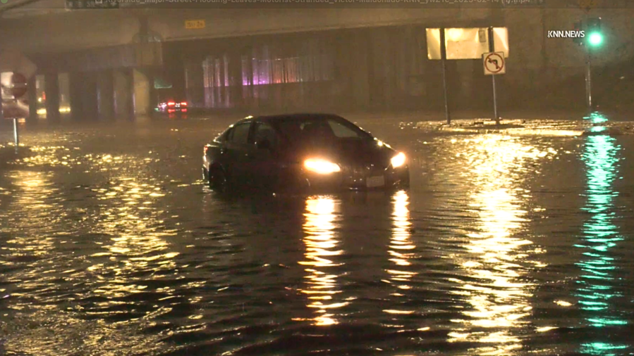 Storm closes busy street, leaves motorists trapped in Riverside 2 Riverside motorist stuck oDoCT6