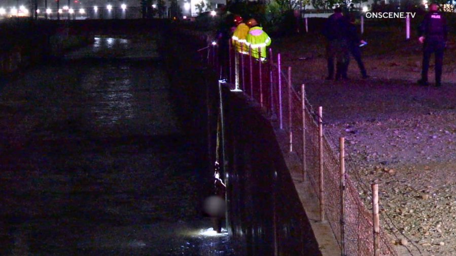 Nude man saved from rushing waters of rain-filled Southern California canal 2 San Bernardino rescue